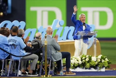 Buck Martinez waves to the fans during a pregame ceremony to honour him before a game between the Toronto Blue Jays and Seattle Mariners at Rogers Centre