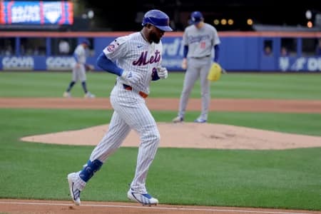 New York Mets center fielder Luis Robert Jr. (88) rounds the bases after hitting a solo home run against Los Angeles Dodgers starting pitcher Roki Sasaki (11) during the second inning at Citi Field.