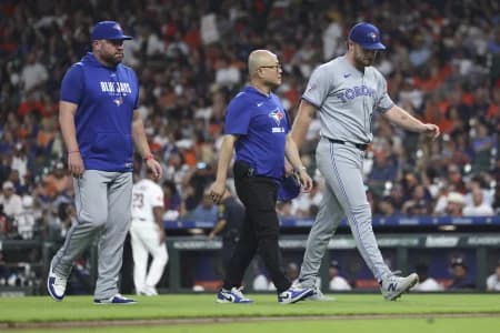 Toronto Blue Jays starting pitcher Trey Yesavage (39) walks off the field after an apparent injury during the third inning against the Houston Astros at Daikin Park.