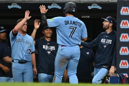 Toronto Blue Jays third baseman Kazuma Okamoto (7) celebrates after scoring during the fifth inning against the Cleveland Guardians at Progressive Field