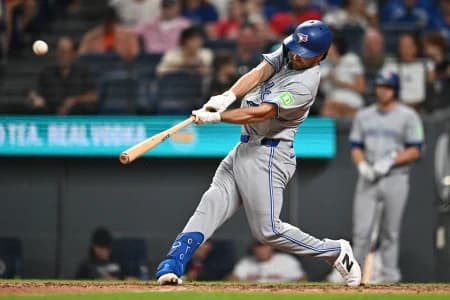 Toronto Blue Jays second baseman Josh Smith (9) hits a home run during the eighth inning against the Cleveland Guardians at Progressive Field.