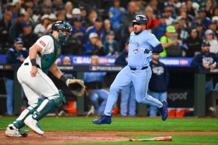 Toronto Blue Jays right fielder Anthony Santander (25) scores on a single from Toronto Blue Jays second baseman Ernie Clement (22) (not pictured) during the fifth inning against the Seattle Mariners during game three of the ALCS round for the 2025 MLB playoffs at T-Mobile Park