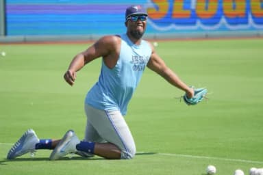Toronto Blue Jays left fielder Jesús Sánchez (12) warms up against the Kansas City Royals prior to a game at Kauffman Stadium