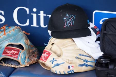Miami Marlins hat sits in the dugout prior to the game against the Kansas City Royals at Kauffman Stadium.
