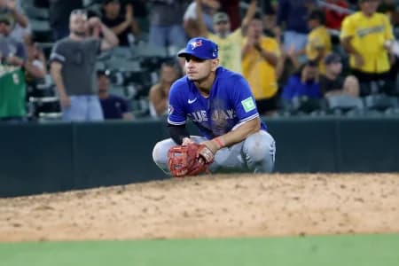 Toronto Blue Jays infielder Andres Gimenez (0) looks on while kneeling after a walk-off infield RBI single hit by Athletics infielder Jeff McNeil (not pictured) during the ninth inning at Sutter Health Park.