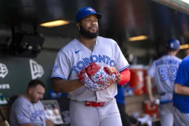Toronto Blue Jays first baseman Vladimir Guerrero Jr. (27) walks in the dugout during a break in the action against the Athletics in the sixth inning at Sutter Health Park.