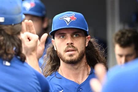 Toronto Blue Jays relief pitcher Spencer Arrighetti (45) is greeted by team mates in the dugout after being relieved against the Baltimore Orioles in the sixth inning at Rogers Centre