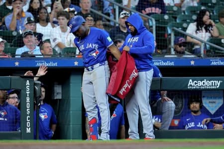 Toronto Blue Jays left fielder Jesus Sanchez (12) is greeted by Toronto Blue Jays first baseman Vladimir Guerrero Jr. (27) after hitting a two-run home run to right field against the Houston Astros during the sixth inning at Daikin Park