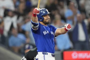 Toronto Blue Jays left fielder Anthony Santander (25) reacts after hitting a foul ball with base loaded against the Boston Red Sox during the third inning at Rogers Centre.