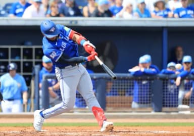 Toronto Blue Jays shortstop Leo Jimenez (49) hits an RBI single during the second inning against the Tampa Bay Rays at Charlotte Sports Park.