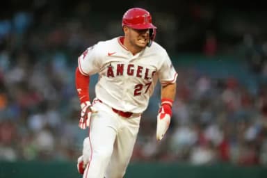 Los Angeles Angels designated hitter Mike Trout (27) rounds third base to score in the first inning against the Minnesota Twins at Angel Stadium.