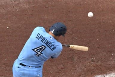 Toronto Blue Jays designated hitter George Springers (4) hits an RBI single against the Detroit Tigers in the fifth inning at Rogers Centre.