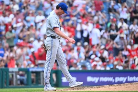Toronto Blue Jays pitcher Shane Bieber (57) reacts after Philadelphia Phillies designated hitter Kyle Schwarber (12) (not pictured) hit a home run during the fifth inning against the Toronto Blue Jays at Citizens Bank Park.