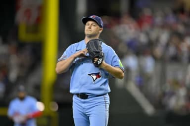 Toronto Blue Jays relief pitcher Paul Sewald (43) walks off the field after hs pitches against the Texas Rangers during the sixth inning at Globe Life Field.
