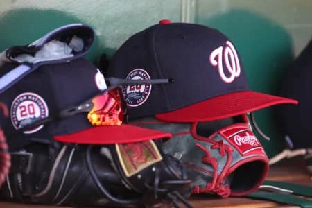 Washington Nationals hats and gloves in the dugout against the Pittsburgh Pirates during the sixth inning at PNC Park.