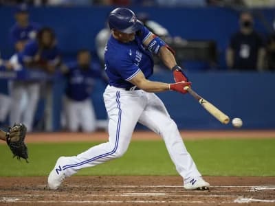 Toronto Blue Jays center fielder Randal Grichuk (15) hits an RBI double against the Tampa Bay Rays in the fourth inning at Rogers Centre.