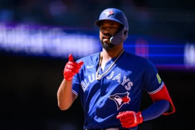 Toronto Blue Jays outfielder Eloy Jiménez (74) gestures after hitting a single during the ninth inning against the Los Angeles Angels at Angel Stadium