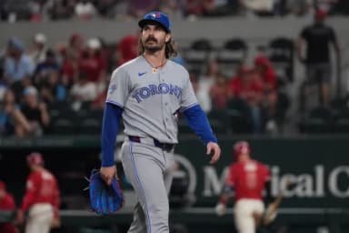 Toronto Blue Jays pitcher Dylan Cease (84) walks off the field after giving up four runs to the Texas Rangers during the second inning at Globe Life Field.