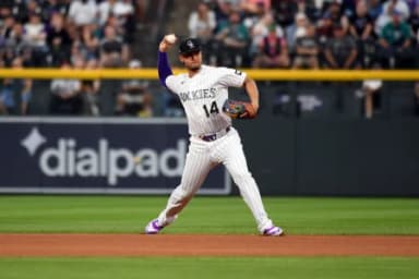 Colorado Rockies infielder Ezequiel Tovar (14) throws to first for an out in the first inning against the Seattle Mariners at Coors Field.