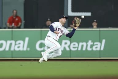 Houston Astros center fielder Daulton Varsho (18) makes a catch on a fly ball during the third inning against the Toronto Blue Jays at Daikin Park.
