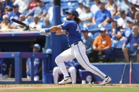 Toronto Blue Jays third baseman Addison Barger (47) hits a solo home run against the Detroit Tigers in the second inning during spring training at TD Ballpark.