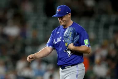 Toronto Blue Jays pitcher Paul Sewald (43) reacts and walks to the dugout after a pitching change against the Athletics during the seventh inning at Sutter Health Park.
