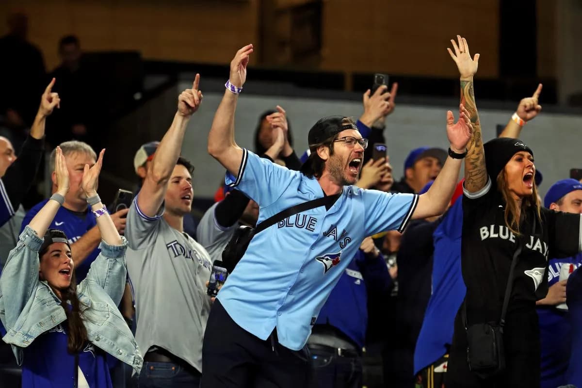 Fans celebrate after the Toronto Blue Jays beat the New York Yankees to win the ALDS round for the 2025 MLB playoffs at Yankee Stadium.