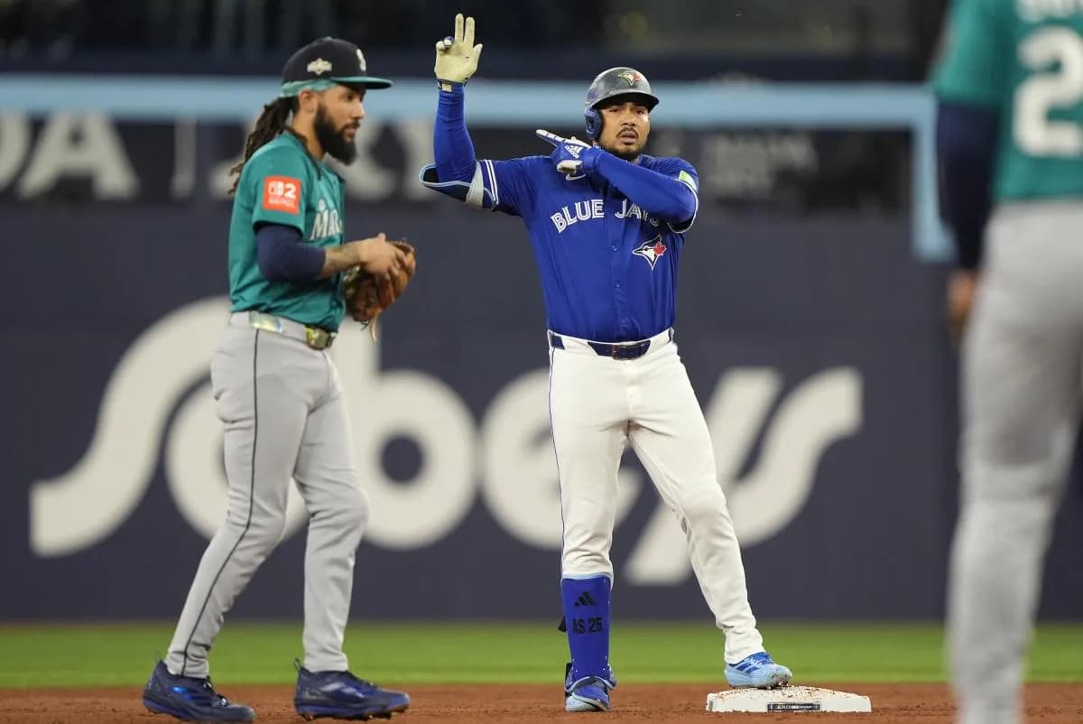 Toronto Blue Jays right fielder Anthony Santander (25) celebrates at second base in the second inning against the Seattle Mariners during game one of the ALCS round for the 2025 MLB playoffs at Rogers Centre.