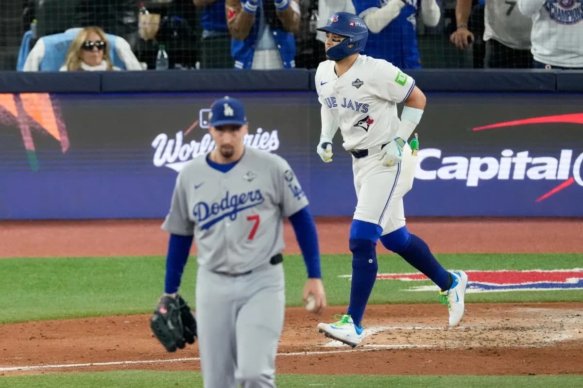 Los Angeles Dodgers pitcher Blake Snell (7) reacts as Toronto Blue Jays second baseman Bo Bichette (11) walks in the sixth inning during game one of the 2025 MLB World Series at Rogers Centre.