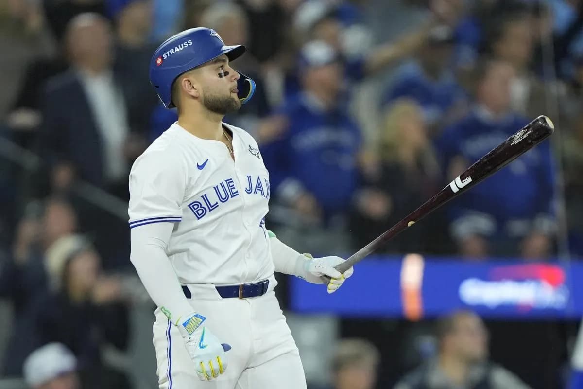 Toronto Blue Jays designated hitter Bo Bichette (11) hits a three run home run against the Los Angeles Dodgers in the third inning during game seven of the 2025 MLB World Series at Rogers Centre