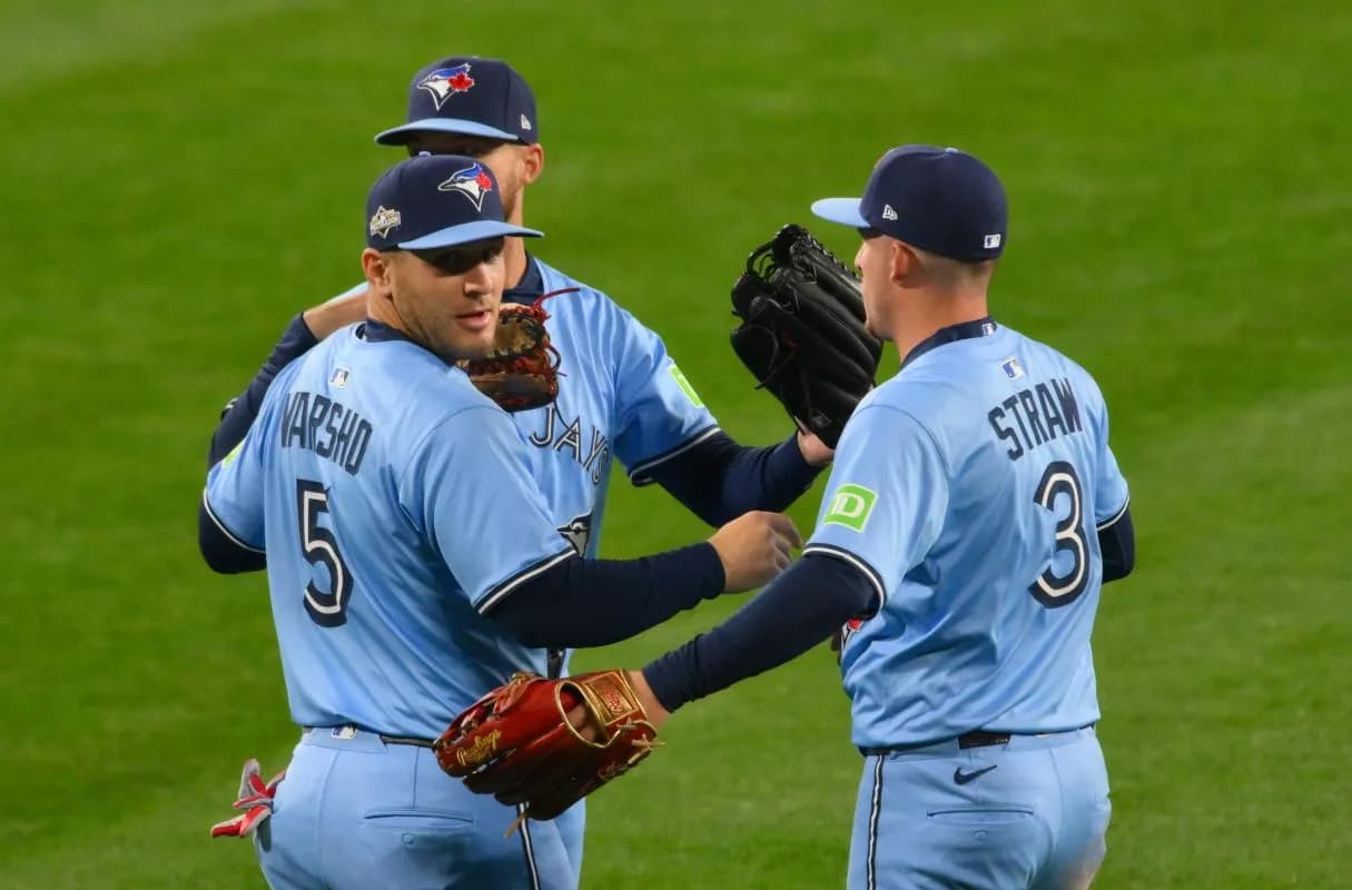Toronto Blue Jays right fielder Nathan Lukes (38), center fielder Daulton Varsho (5) and center fielder Myles Straw (3) celebrate after winning game four of the ALCS round for the 2025 MLB playoffs against the Seattle Mariners at T-Mobile Park.