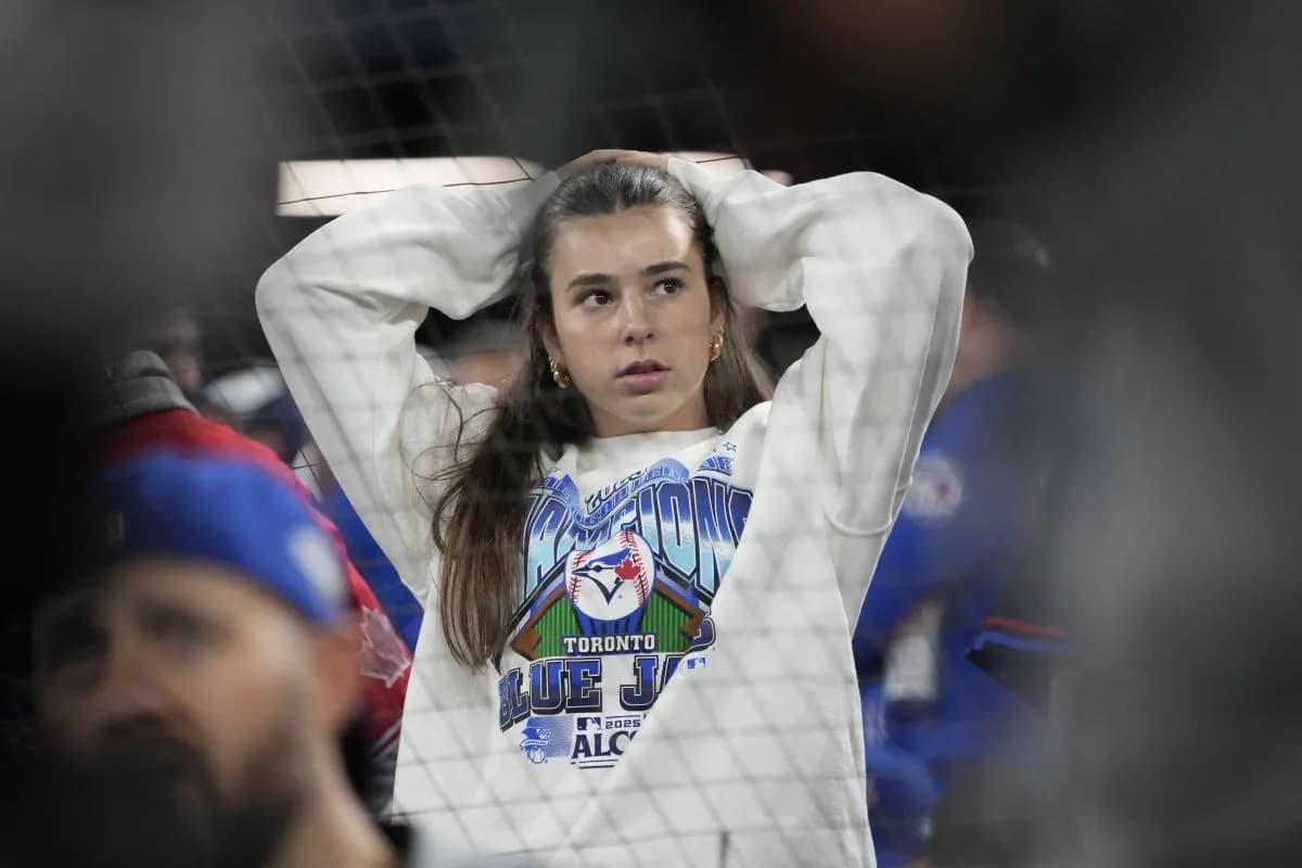 A fan looks on in the ninth inning between the Toronto Blue Jays and the Los Angeles Dodgers during game seven of the 2025 MLB World Series at Rogers Centre.