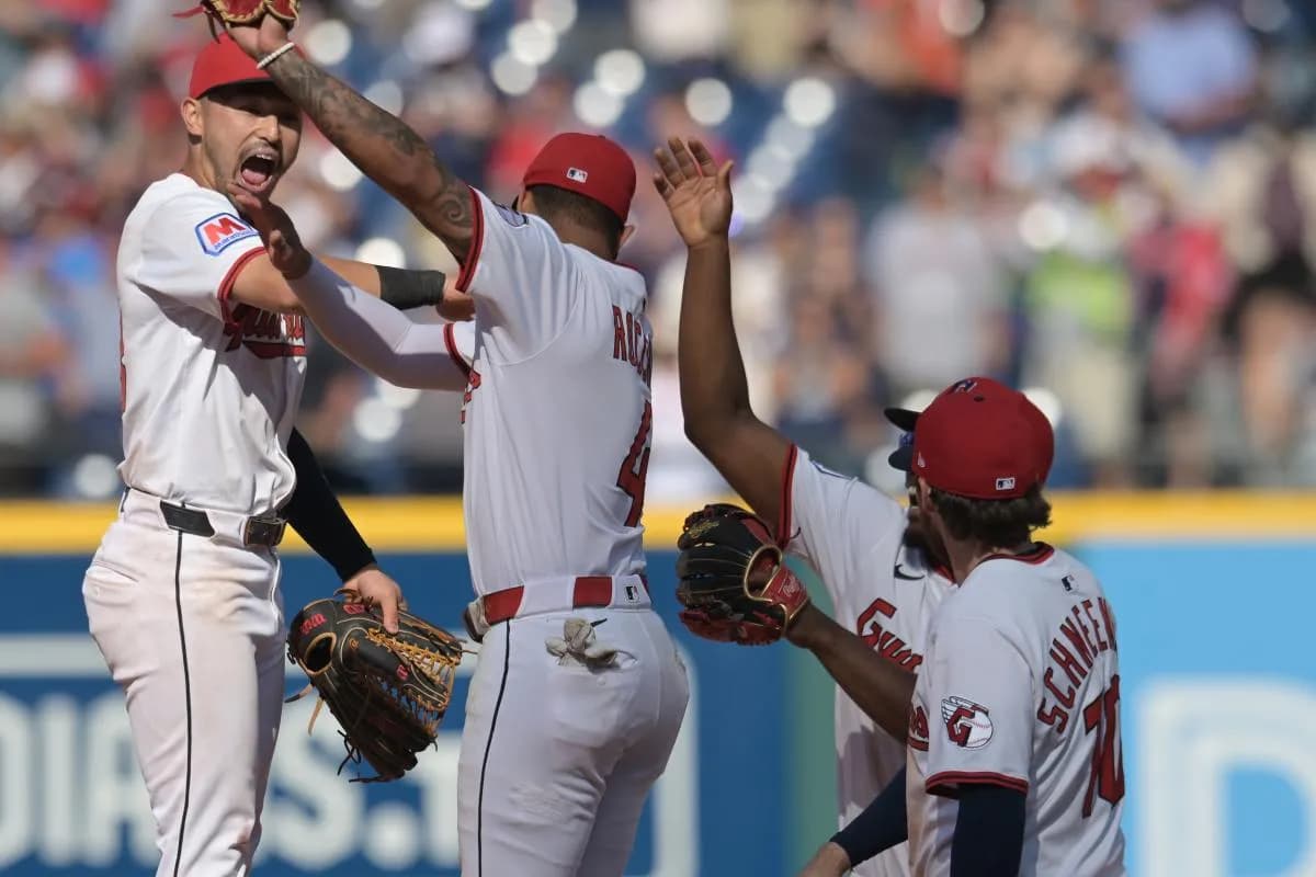 Cleveland Guardians left fielder Steven Kwan, left, and second baseman Brayan Rocchio (4) celebrate after the Guardians beat the Chicago White Sox at Progressive Field.