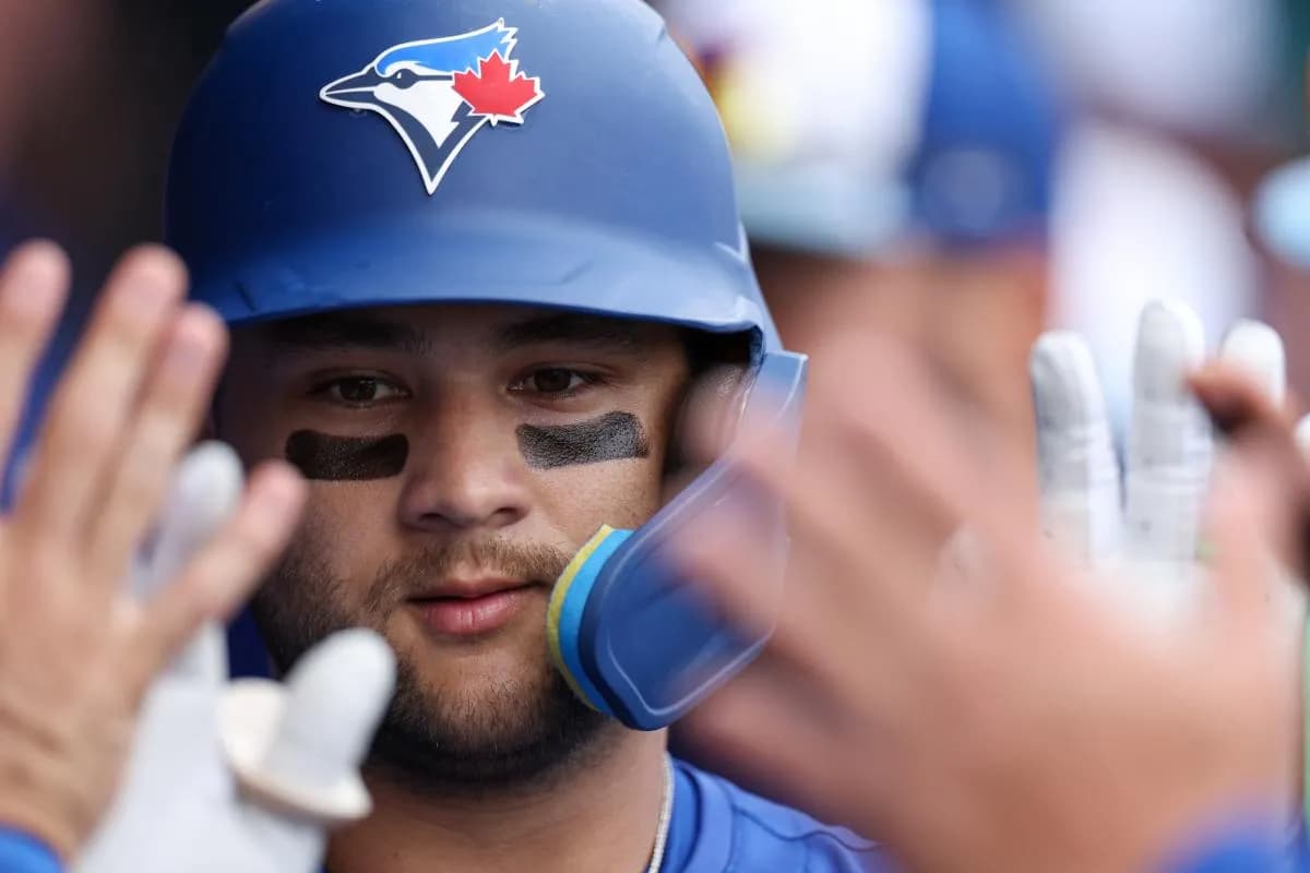 Toronto Blue Jays shortstop Bo Bichette (11) is congratulated after hitting a home run against the Houston Astros in the third inning during spring training at TD Ballpark.