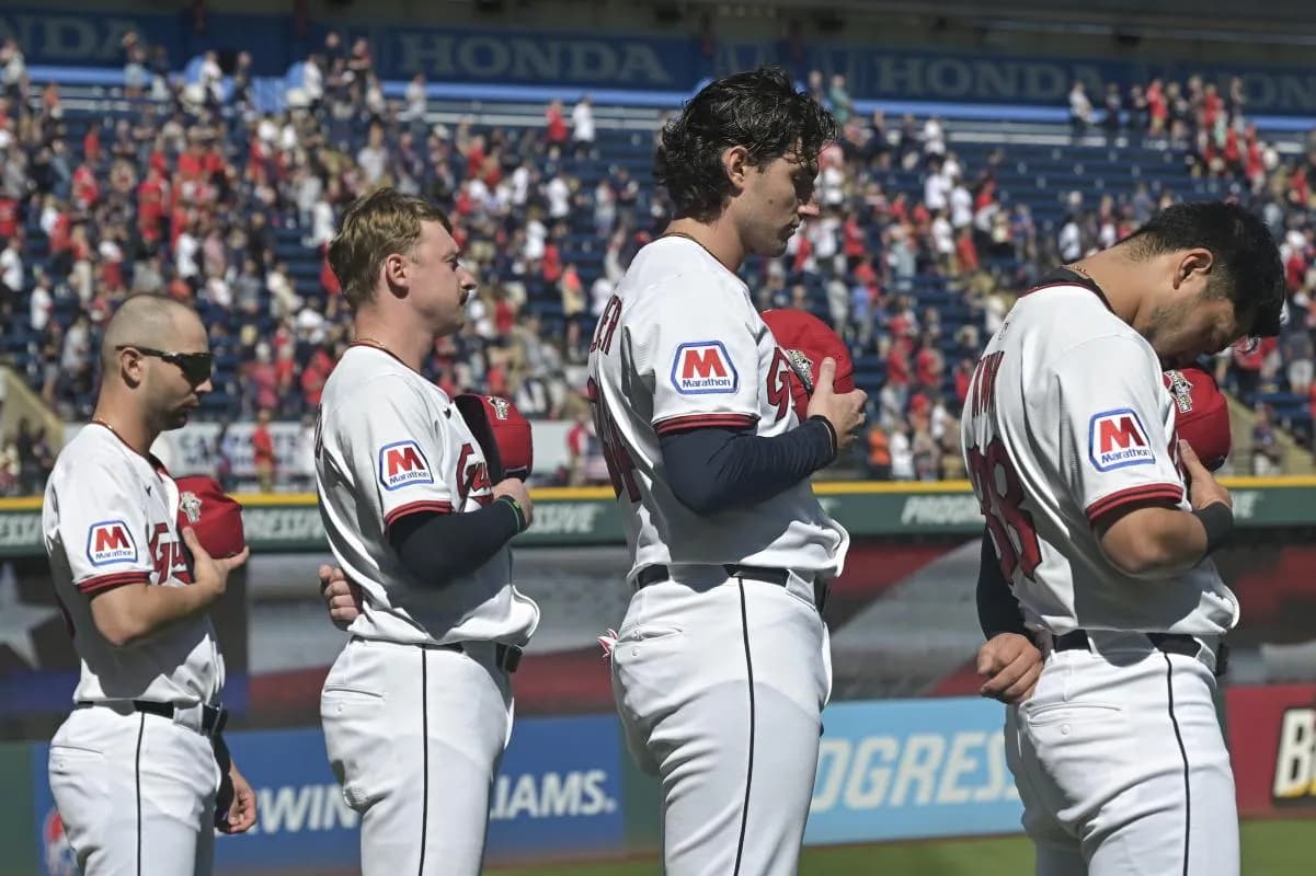 Cleveland Guardians first base C.J. Kayfus (63), first base Kyle Manzardo (9), center fielder Chase DeLauter (34), and outfielder Steven Kwan (38) stand for the national anthem before game two of the Wildcard round for the 2025 MLB playoffs against the Detroit Tigers at Progressive Field.