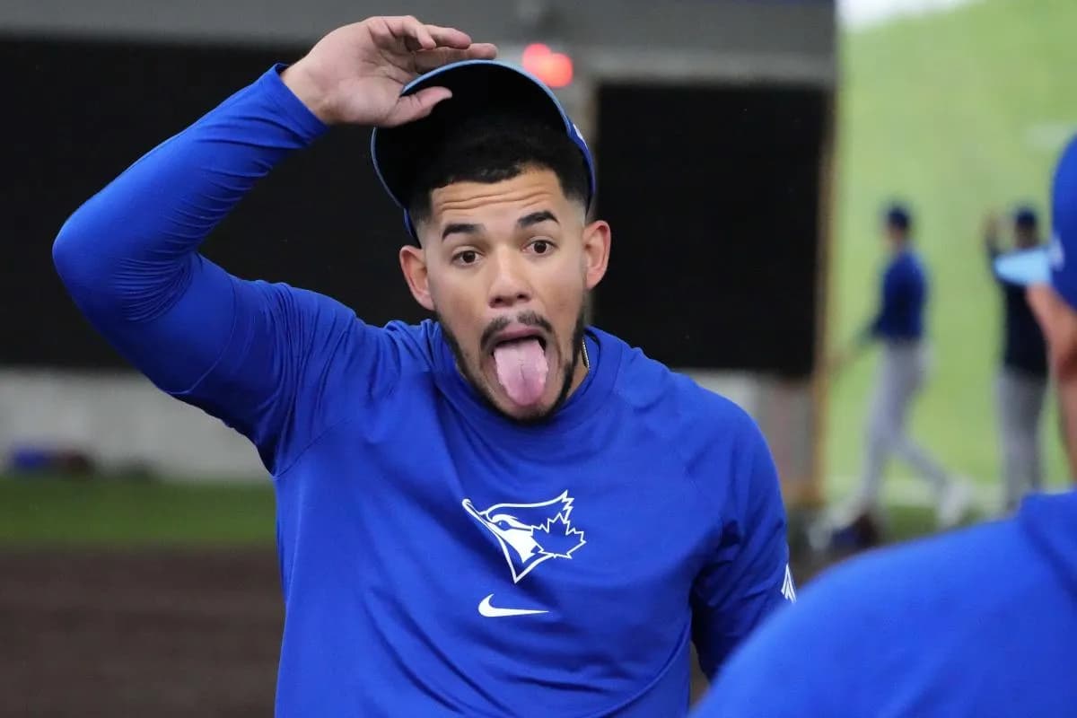 Toronto Blue Jays pitcher Jose Berrios (17) jokes around with teammates at Spring Training practice at the Blue Jays Player Development Complex