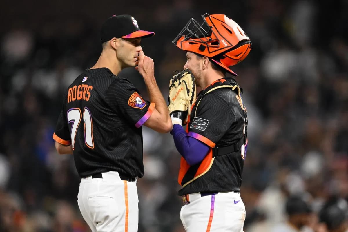 San Francisco Giants pitcher Tyler Rogers (71) talks to catcher Patrick Bailey (14) against the Pittsburgh Pirates during the eighth inning at Oracle Park.