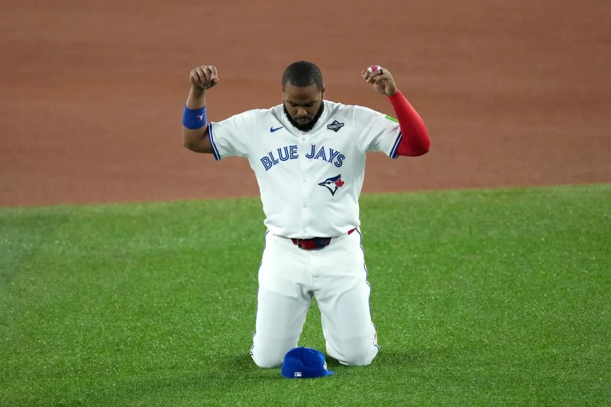 Toronto Blue Jays first baseman Vladimir Guerrero Jr. (27) prays on the field before game two of the 2025 MLB World Series against the Los Angeles Dodgers at Rogers Centre.