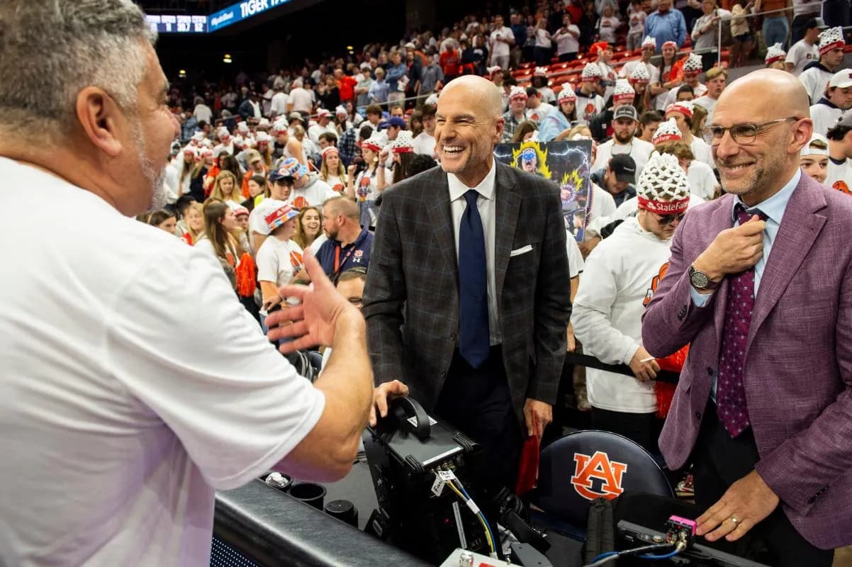Auburn Tigers head coach Bruce Pearl jokes with ESPN announcers Jay Bilas and Dan Shulman after the game as Auburn Tigers men's basketball takes on Texas AM Aggies at Auburn Arena in Auburn, Ala., on Saturday, Feb. 12, 2022. Auburn Tigers defeated Texas AM Aggies 75-58.