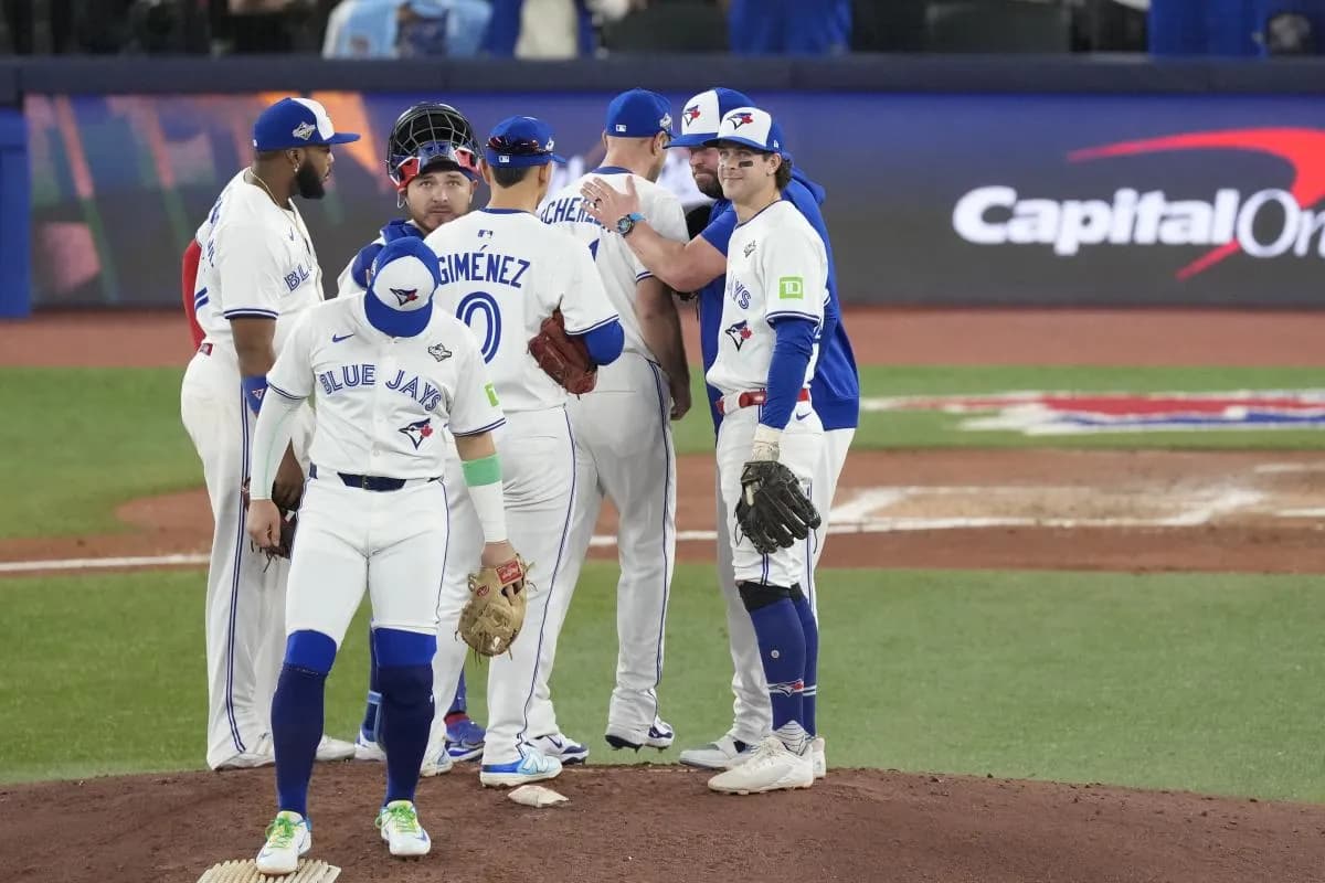Toronto Blue Jays manager John Schneider (14) relieves pitcher Max Scherzer (31) in the fifth inning during game seven of the 2025 MLB World Series at Rogers Centre.