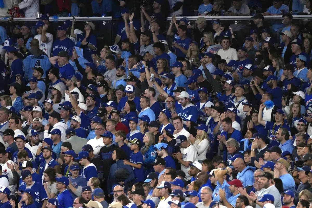Fans look on in the ninth inning between the Toronto Blue Jays and the Los Angeles Dodgers during game seven of the 2025 MLB World Series at Rogers Centre.
