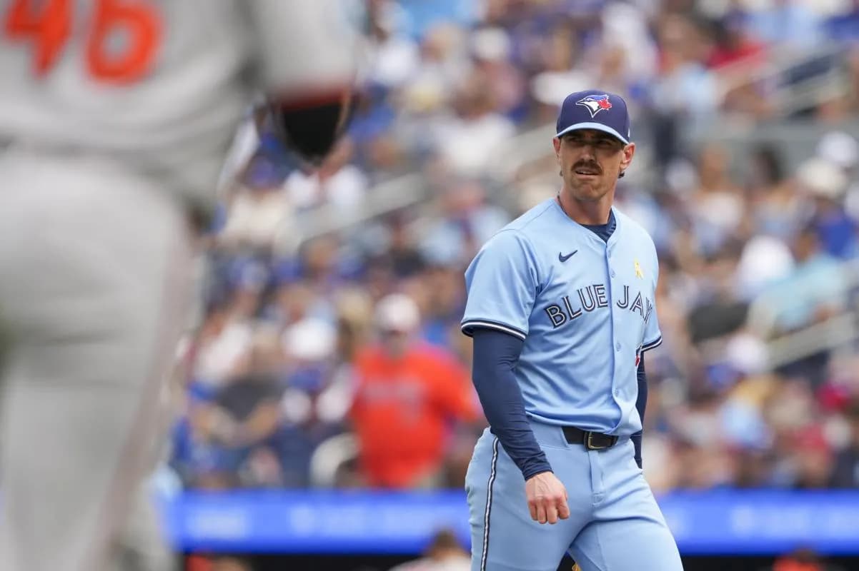 Toronto Blue Jays pitcher Shane Bieber (57) walks back to the dugout after the second inning against the Baltimore Orioles at Rogers Centre.