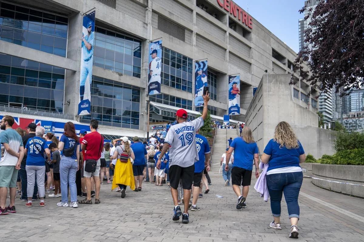 Toronto Blue Jays fan arrives at the Rogers Centre in a Jose Bautista jersey to celebrate his retirement before an MLB game against the Chicago Cubs at Rogers Centre.