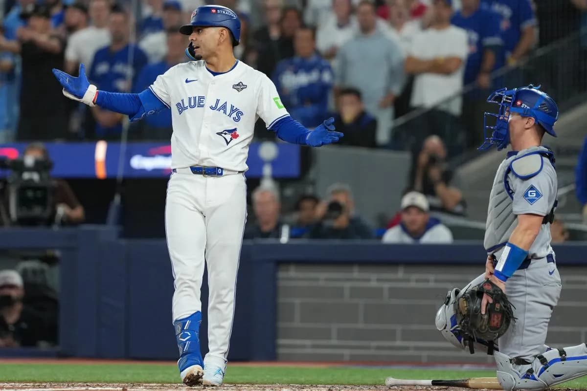 Toronto Blue Jays second basemen Andres Gimenez (0) reacts after being hit by a pitch in the fourth inning for game seven of the 2025 MLB World Series at Rogers Centre.