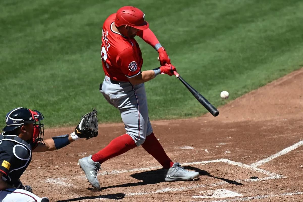 Washington Nationals first baseman Juan Yepez (18) hits a RBI single in the fourth inning against the Atlanta Braves during spring training at CoolToday Park.