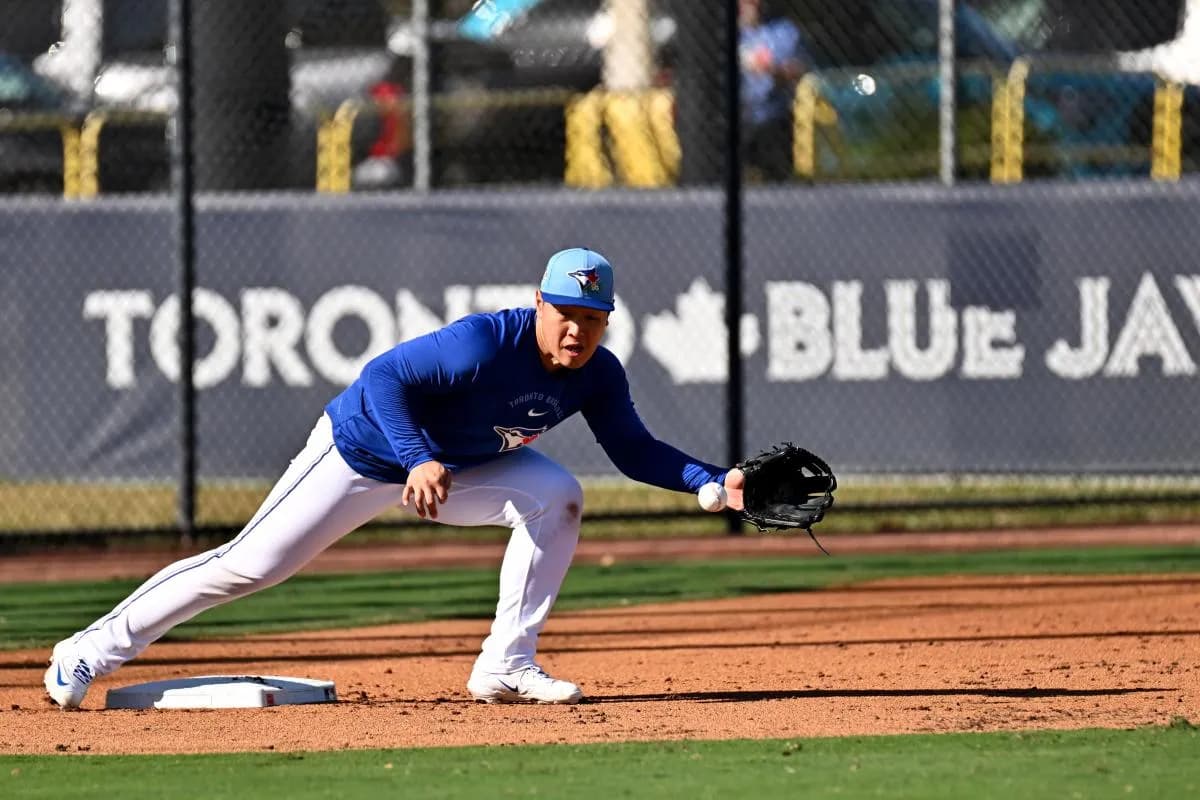 Toronto Blue Jays infielder Kazuma Okamoto (7) fields a ground ball during spring training at Bobby Mattick Training Center at Englebert Complex.