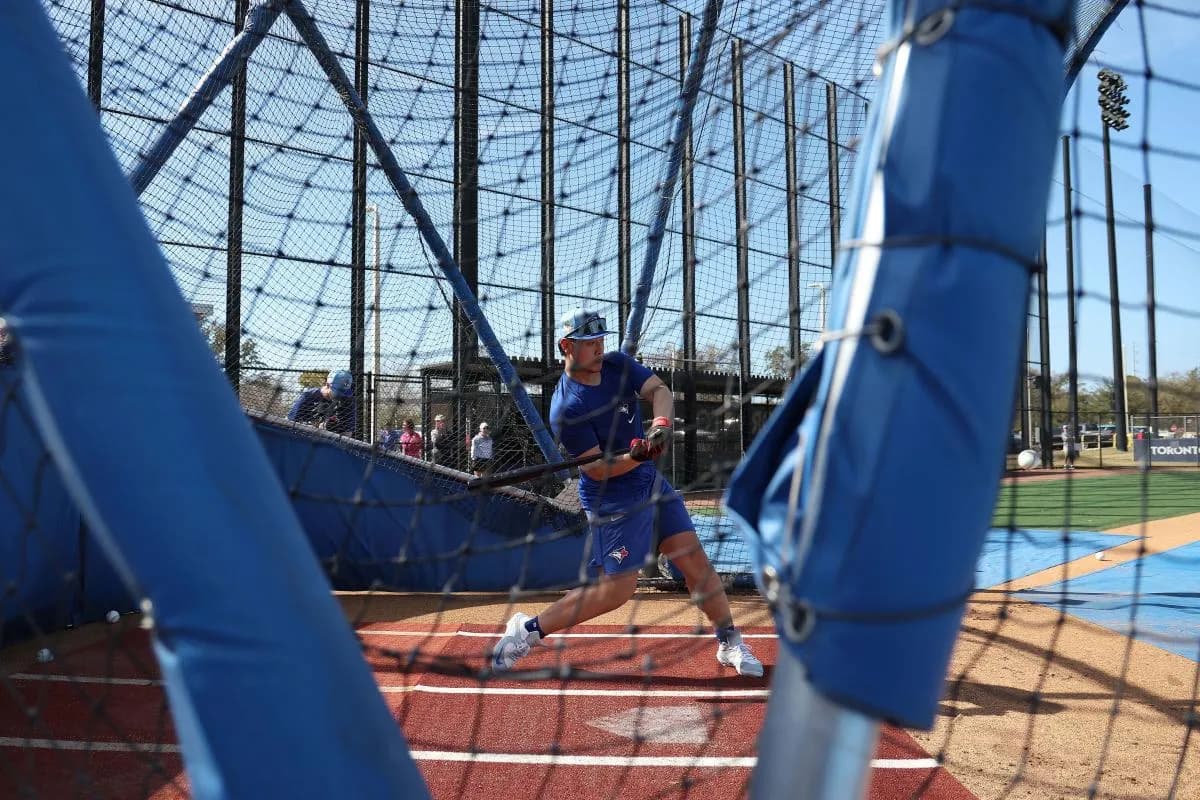 Toronto Blue Jays infielder Kazuma Okamoto (7) bats during spring training practices.