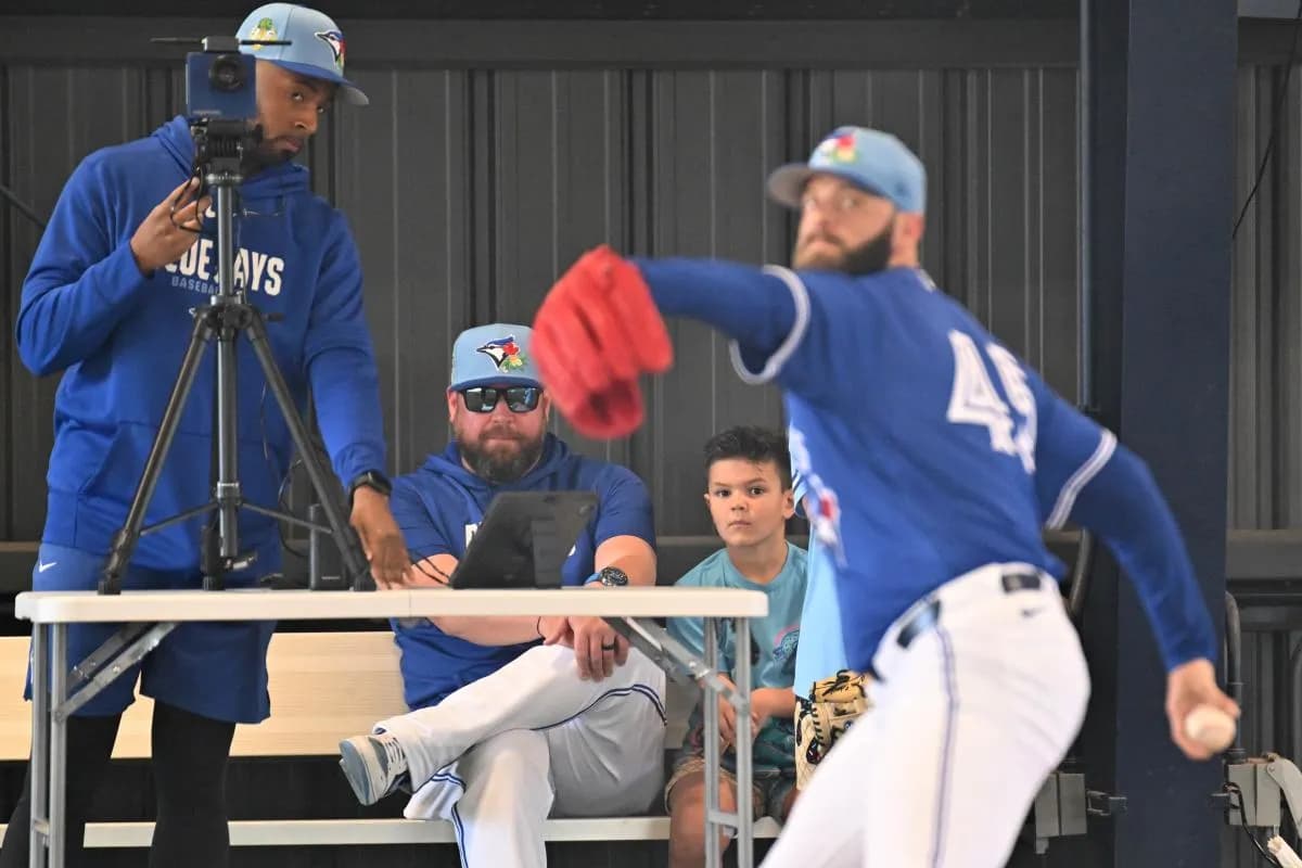 Toronto Blue Jays manager John Schneider (14) watches pitcher Tommy Nance (45) during spring training at the Bobby Mattick Training Center at Englebert Complex.