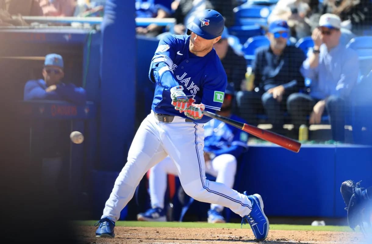 Toronto Blue Jays designated hitter Daulton Varsho (5) triples during the first inning against the New York Yankees at TD Ballpark.