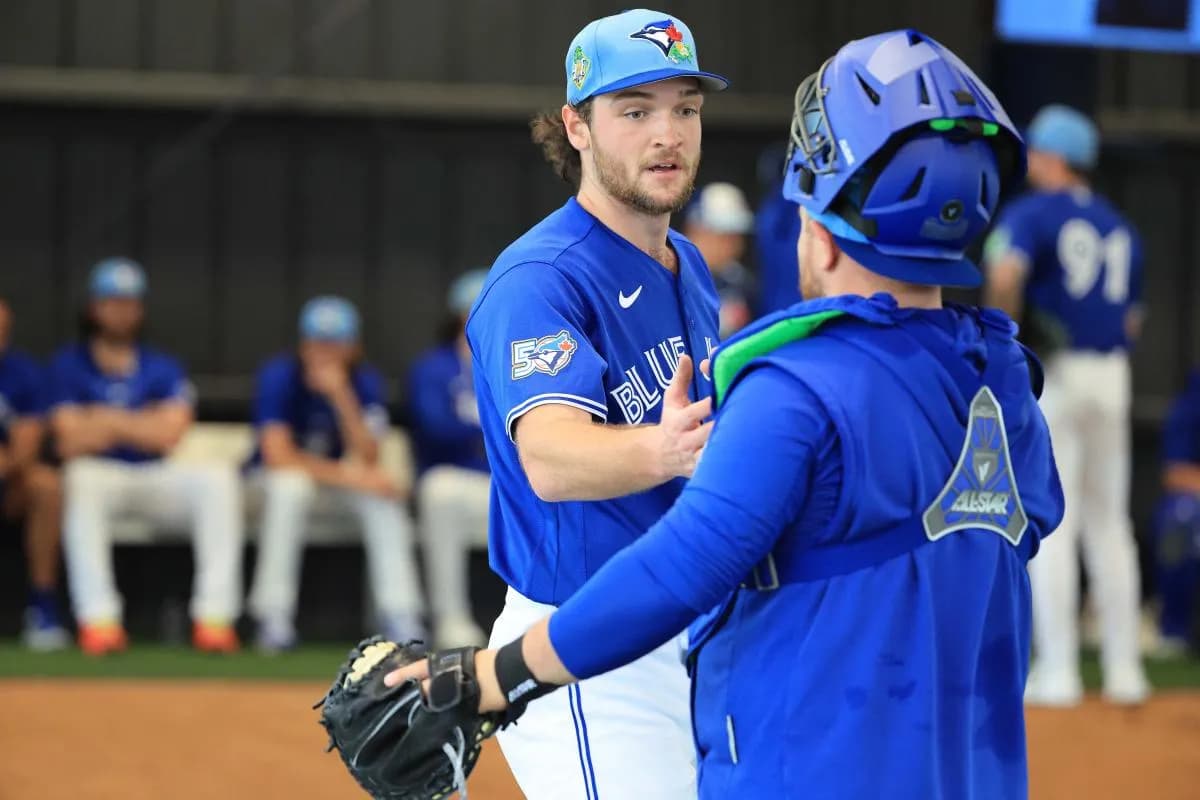Toronto Blue Jays pitcher Trey Yesavage (39) and catcher Alejandro Kirk (30) greet after the bullpen session for spring training practice at Blue Jays Player Development Complex.